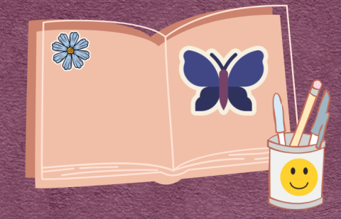 Pink journal with butterfly and flower. Smiley cup with paintbrushes.