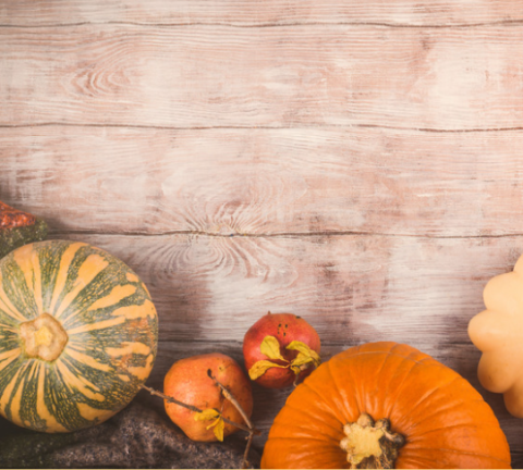 assortment of pumpkins on wood table