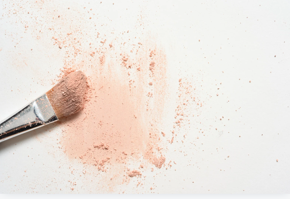 make up and a make up brush on a white background with words fall makeup & skin care